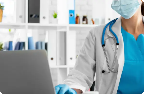 doctor working on a laptop
